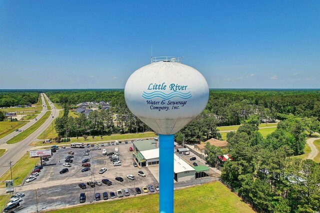 610 Putters Ln Unit H-109, Little River, SC 29566 - aerial view with a forest view