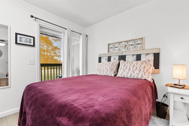 610 Putters Ln Unit H-109, Little River, SC 29566 - bedroom featuring baseboards, ornamental molding, and access to exterior