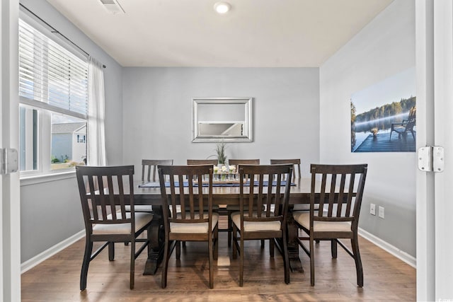 7037 Grant St, Little River, SC 29566 - dining area featuring wood finished floors and baseboards