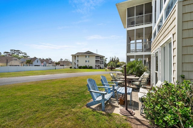 213 Landing Rd Unit A, North Myrtle Beach, SC 29582 - view of green lawn featuring a residential view and a patio