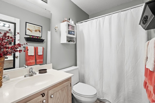 213 Landing Rd Unit A, North Myrtle Beach, SC 29582 - bathroom featuring vanity, toilet, a textured ceiling, and curtained shower