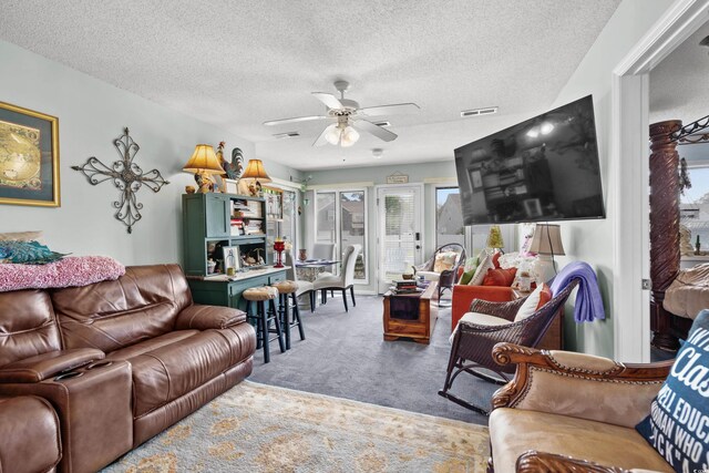 213 Landing Rd Unit A, North Myrtle Beach, SC 29582 - living room featuring light colored carpet, a ceiling fan, and a textured ceiling