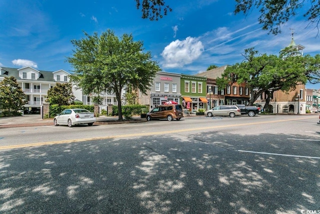 view of road featuring sidewalks and curbs
