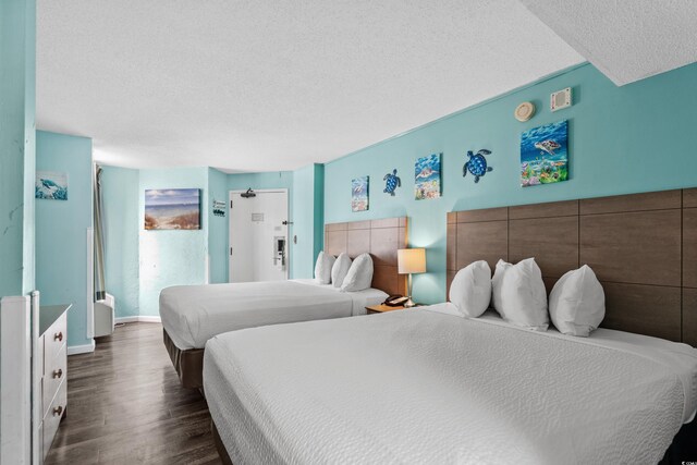 1501 S Ocean Blvd Unit 845, Myrtle Beach, SC 29577 - bedroom featuring baseboards, a textured ceiling, and dark wood finished floors