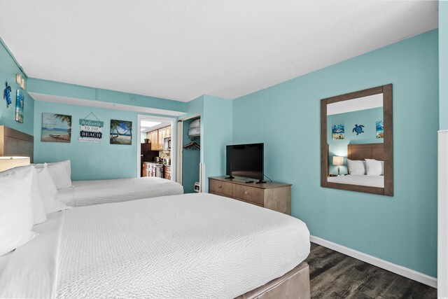 1501 S Ocean Blvd Unit 845, Myrtle Beach, SC 29577 - bedroom with baseboards and dark wood finished floors
