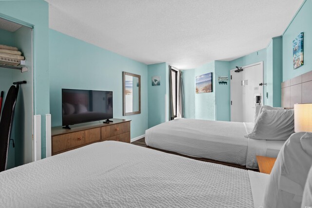 1501 S Ocean Blvd Unit 845, Myrtle Beach, SC 29577 - bedroom featuring a textured ceiling
