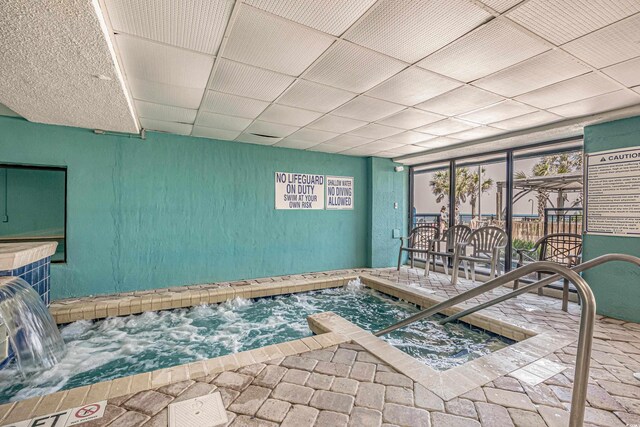 1501 S Ocean Blvd Unit 845, Myrtle Beach, SC 29577 - interior space featuring brick floor and a drop ceiling