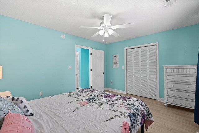 1521 Edge Dr, North Myrtle Beach, SC 29582 - bedroom with baseboards, wood finished floors, a closet, and visible vents