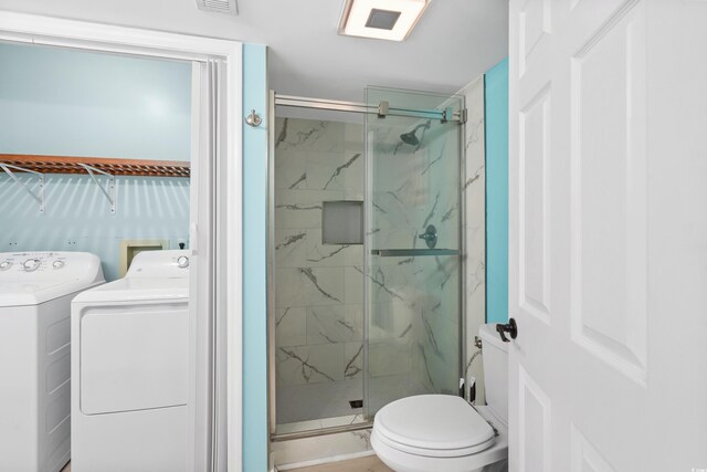 1521 Edge Dr, North Myrtle Beach, SC 29582 - bathroom featuring vanity, toilet, a marble finish shower, visible vents, and independent washer and dryer