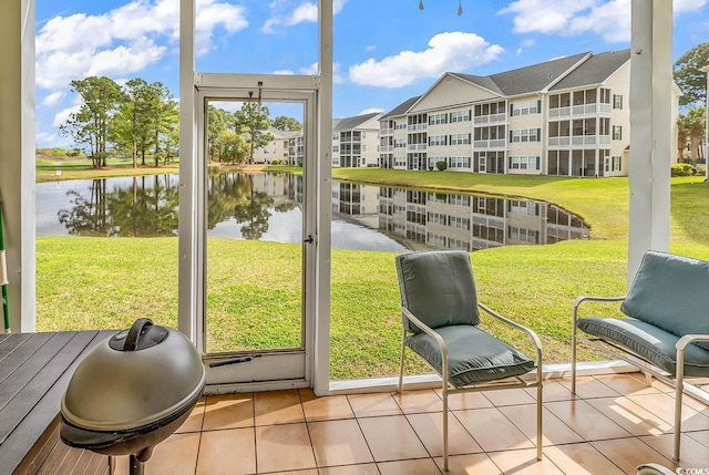 5090 Windsor Green Way Unit 103, Myrtle Beach, SC 29579 - sunroom featuring a water view