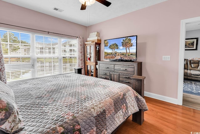 5090 Windsor Green Way Unit 103, Myrtle Beach, SC 29579 - bedroom featuring wood finished floors and ceiling fan