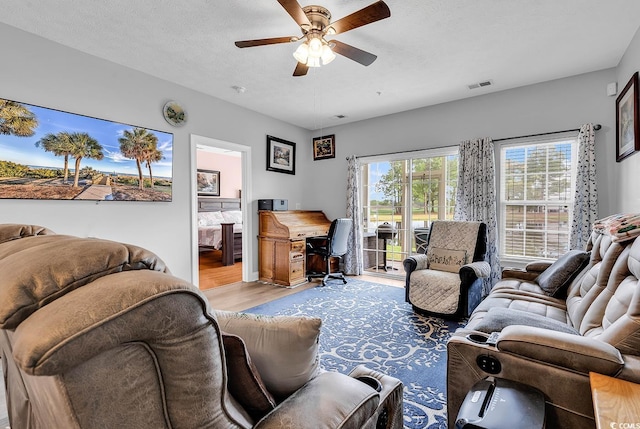 5090 Windsor Green Way Unit 103, Myrtle Beach, SC 29579 - living room with wood finished floors, a ceiling fan, and a desk
