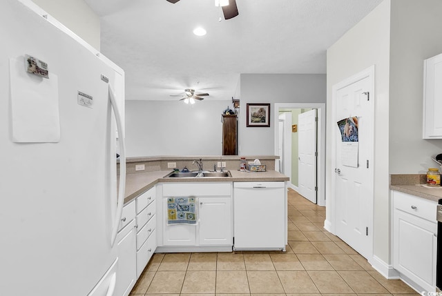 5090 Windsor Green Way Unit 103, Myrtle Beach, SC 29579 - kitchen featuring white appliances, ceiling fan, a peninsula, and white cabinetry