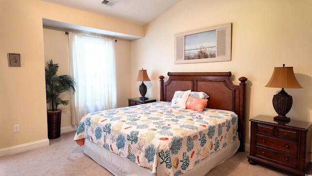 bedroom featuring light carpet, baseboards, and visible vents