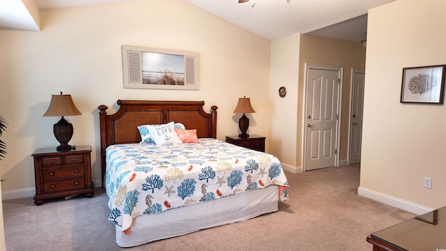 carpeted bedroom featuring baseboards and vaulted ceiling