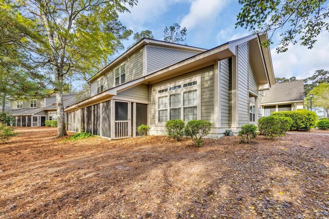 1545 Spinnaker Dr Unit 2C, North Myrtle Beach, SC 29582 - view of property exterior featuring a sunroom