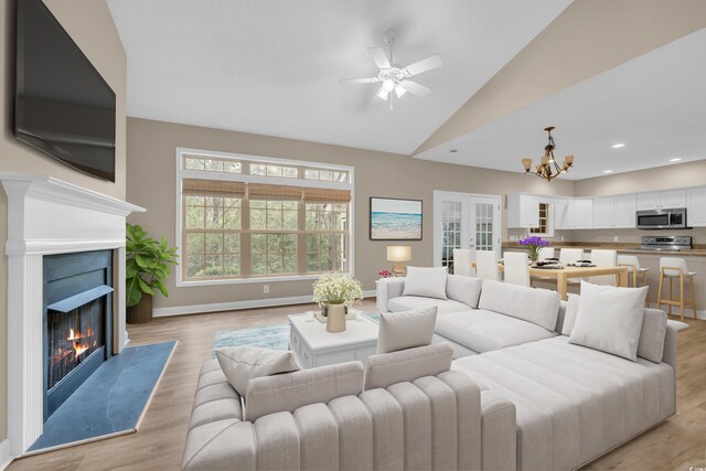 1545 Spinnaker Dr Unit 2C, North Myrtle Beach, SC 29582 - living area featuring a chandelier, a warm lit fireplace, light wood-style floors, high vaulted ceiling, and recessed lighting