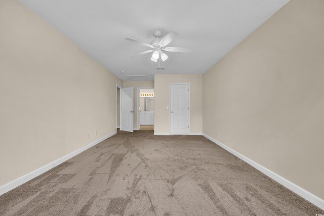 1545 Spinnaker Dr Unit 2C, North Myrtle Beach, SC 29582 - empty room featuring carpet floors, ceiling fan, and baseboards