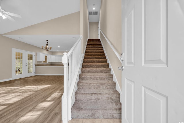 1545 Spinnaker Dr Unit 2C, North Myrtle Beach, SC 29582 - staircase with a chandelier, wood finished floors, ceiling fan, recessed lighting, and lofted ceiling
