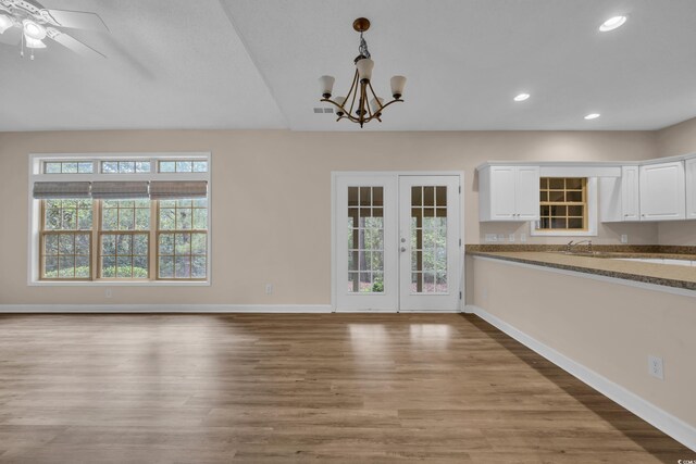 1545 Spinnaker Dr Unit 2C, North Myrtle Beach, SC 29582 - unfurnished dining area with healthy amount of natural light, a chandelier, baseboards, wood finished floors, and recessed lighting
