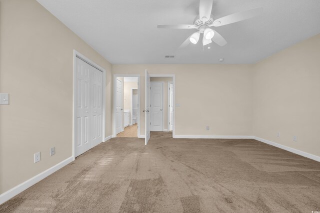 1545 Spinnaker Dr Unit 2C, North Myrtle Beach, SC 29582 - unfurnished bedroom featuring carpet flooring, baseboards, ceiling fan, and a closet