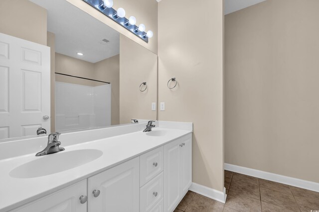 1545 Spinnaker Dr Unit 2C, North Myrtle Beach, SC 29582 - full bathroom with double vanity, tile patterned flooring, a shower, and baseboards