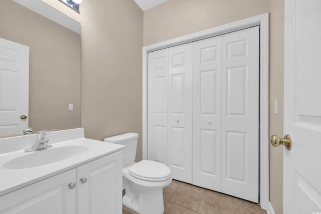 1545 Spinnaker Dr Unit 2C, North Myrtle Beach, SC 29582 - bathroom featuring a closet, vanity, toilet, and tile patterned flooring
