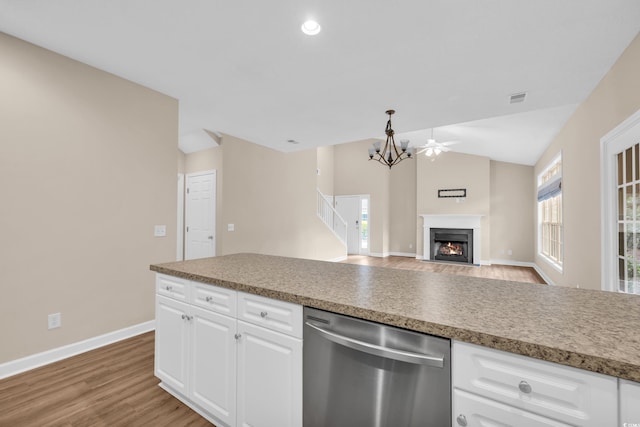 1545 Spinnaker Dr Unit 2C, North Myrtle Beach, SC 29582 - kitchen featuring stainless steel dishwasher, vaulted ceiling, baseboards, light wood-style floors, and white cabinets