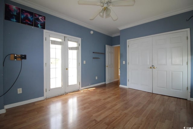 331 S Willow Dr, Surfside Beach, SC 29575 - unfurnished bedroom with french doors, ornamental molding, baseboards, and wood finished floors