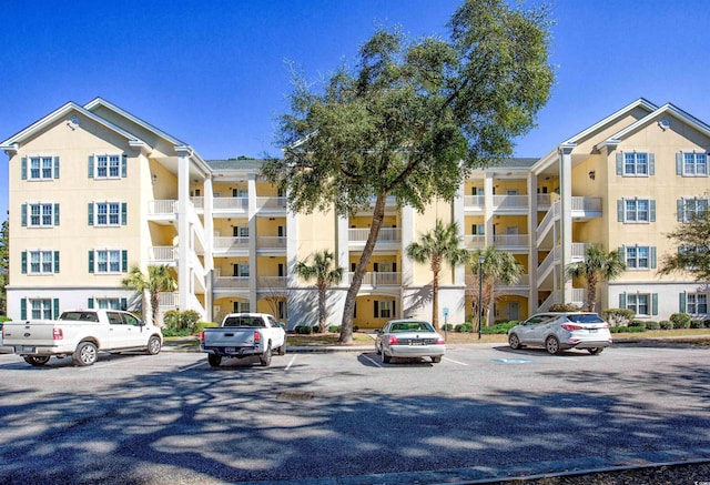 view of property featuring uncovered parking