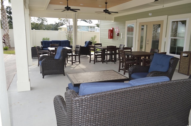 view of patio / terrace with fence, outdoor lounge area, french doors, and outdoor dining area