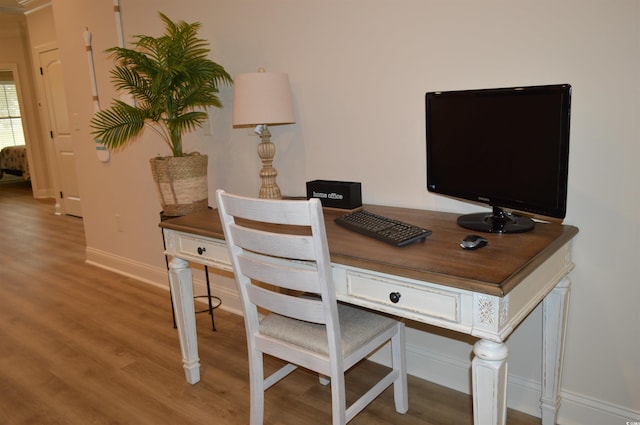 office area featuring wood finished floors and baseboards