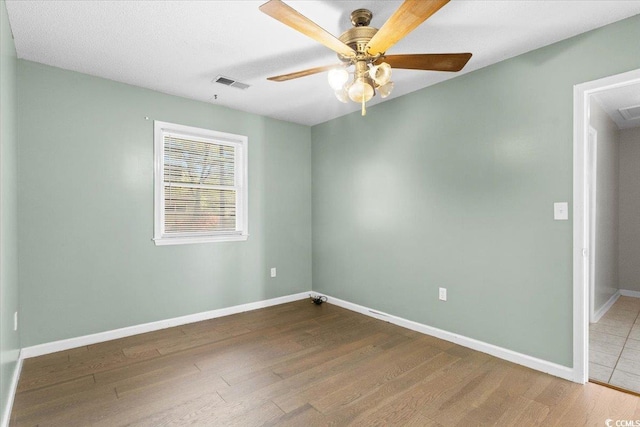 2108 Brunswick Cir, Little River, SC 29566 - spare room with wood finished floors and a ceiling fan