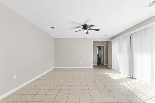 2108 Brunswick Cir, Little River, SC 29566 - empty room featuring a ceiling fan and light tile patterned flooring
