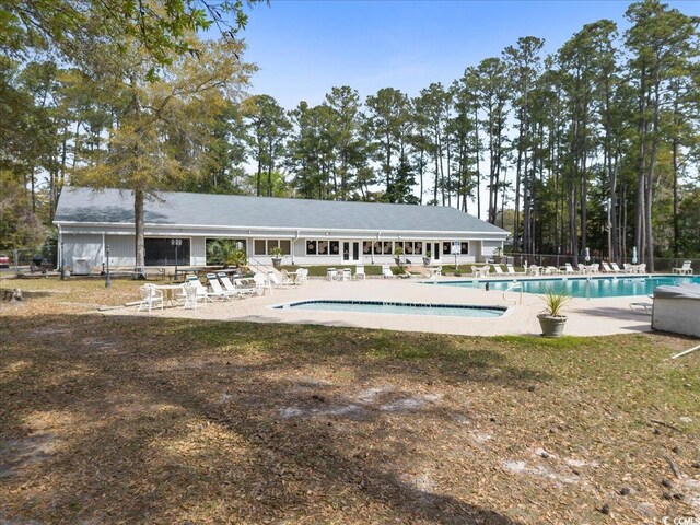 2108 Brunswick Cir, Little River, SC 29566 - community pool featuring a patio