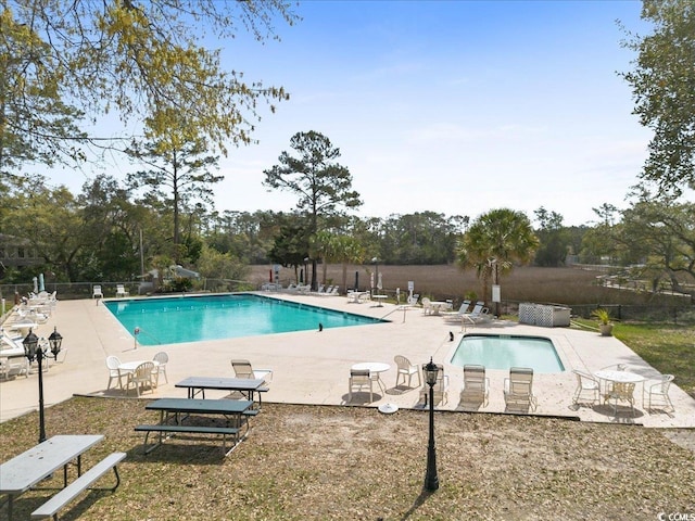 2108 Brunswick Cir, Little River, SC 29566 - community pool featuring a patio and view of wooded area