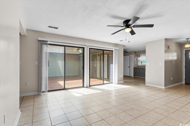 2108 Brunswick Cir, Little River, SC 29566 - empty room featuring ceiling fan, a textured ceiling, and light tile patterned flooring