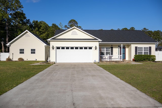7473 Louisville Rd, Aynor, SC 29511 - single story home featuring an attached garage, covered porch, fence, concrete driveway, and a front lawn
