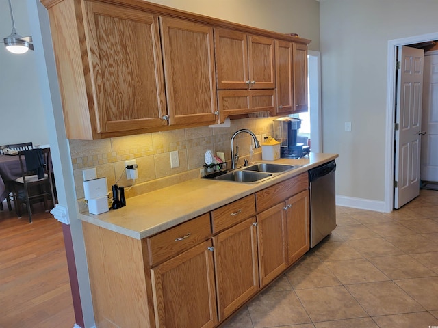 7473 Louisville Rd, Aynor, SC 29511 - kitchen featuring a sink, backsplash, light countertops, and dishwasher