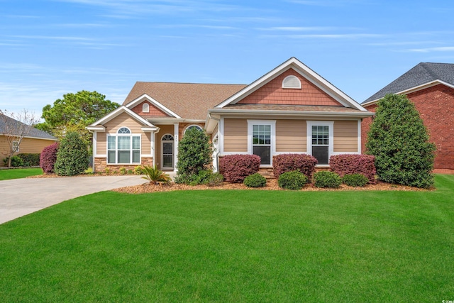826 Sand Binder Dr, Myrtle Beach, SC 29579 - craftsman house with stone siding and a front lawn