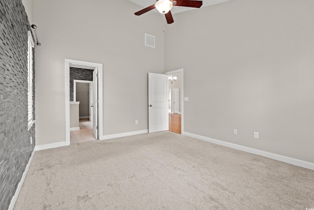 826 Sand Binder Dr, Myrtle Beach, SC 29579 - unfurnished bedroom featuring a towering ceiling, carpet flooring, a chandelier, and ceiling fan