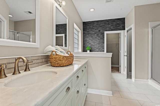 826 Sand Binder Dr, Myrtle Beach, SC 29579 - bathroom featuring a stall shower, double vanity, tile patterned floors, and a spacious closet