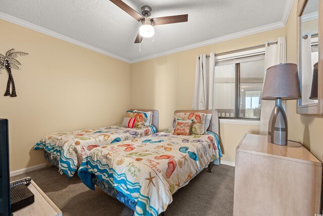 9600 Shore Dr Unit A-207, Myrtle Beach, SC 29572 - carpeted bedroom with ornamental molding, baseboards, a textured ceiling, and a ceiling fan