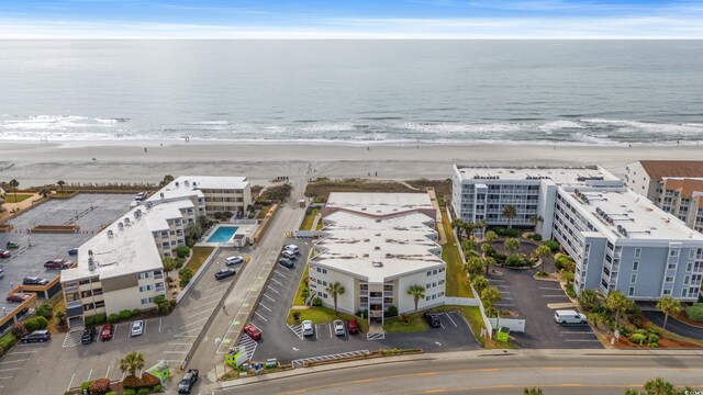 9600 Shore Dr Unit A-207, Myrtle Beach, SC 29572 - drone / aerial view of waterfront with a beach and apartment complex / building
