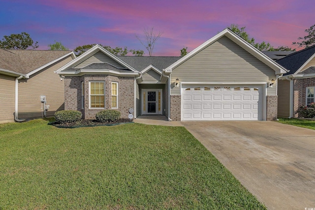 406 Pritchard St, Myrtle Beach, SC 29588 - ranch-style home with a lawn, brick siding, driveway, and a garage