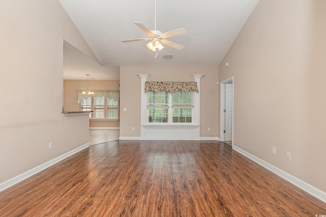 406 Pritchard St, Myrtle Beach, SC 29588 - unfurnished living room featuring baseboards, vaulted ceiling, wood finished floors, and ceiling fan with notable chandelier
