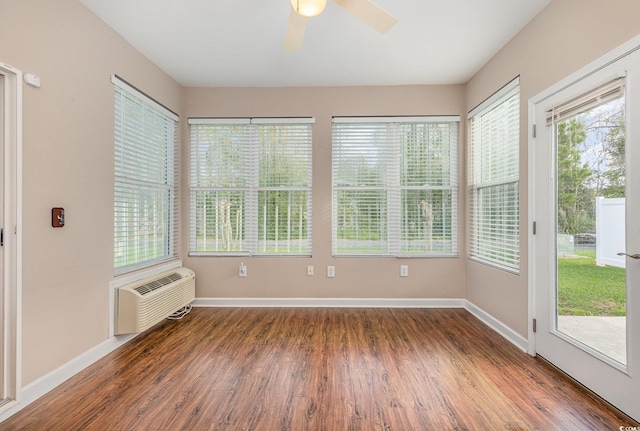 406 Pritchard St, Myrtle Beach, SC 29588 - unfurnished sunroom featuring baseboards, a wall mounted AC, and wood finished floors