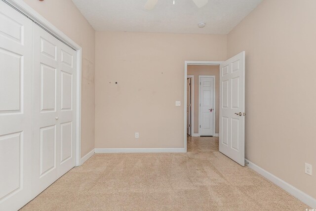 406 Pritchard St, Myrtle Beach, SC 29588 - unfurnished bedroom featuring baseboards, ceiling fan, a closet, and light carpet