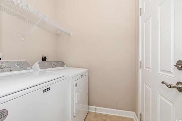 406 Pritchard St, Myrtle Beach, SC 29588 - laundry room featuring independent washer and dryer, light tile patterned flooring, laundry area, and baseboards