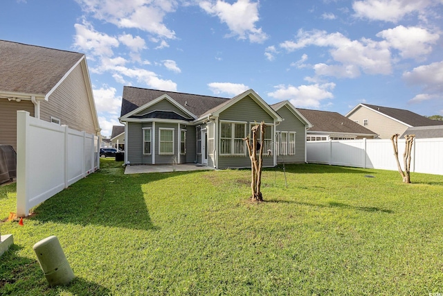 406 Pritchard St, Myrtle Beach, SC 29588 - rear view of property featuring a lawn, a patio, and a fenced backyard